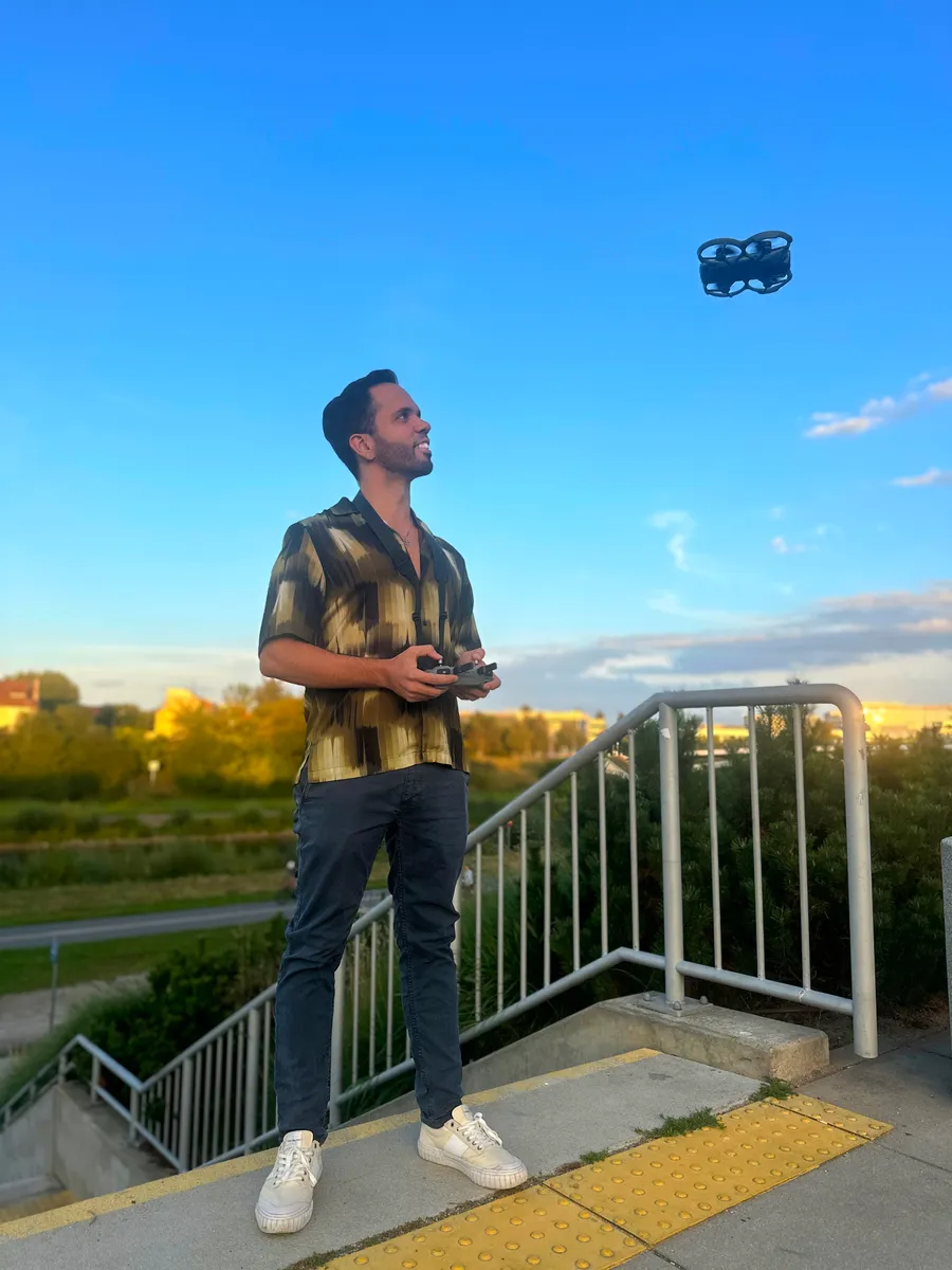 Infinity Drone Films operator flying a drone